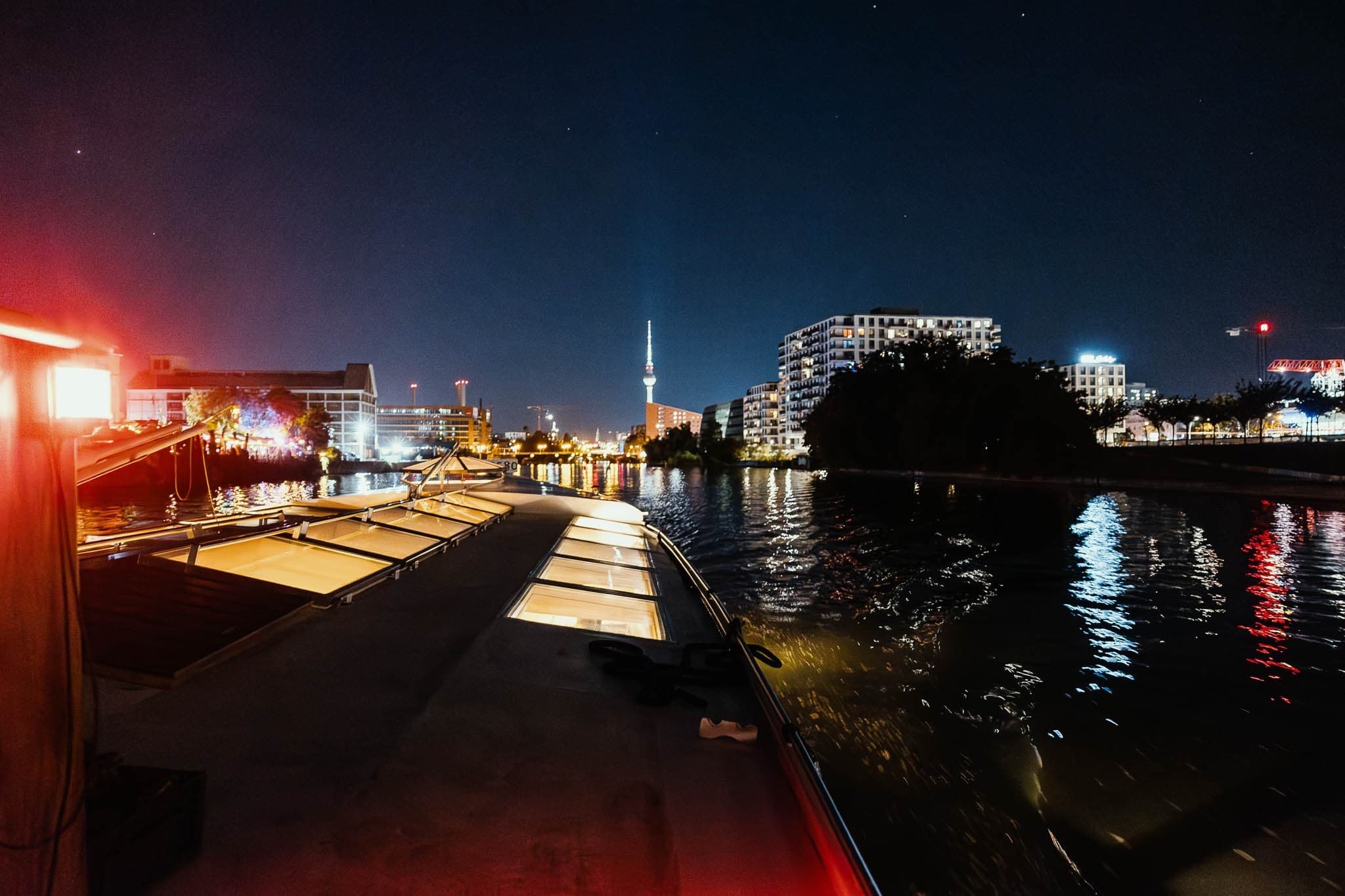 Wide river panorama with sightseeing vessel and urban skyline