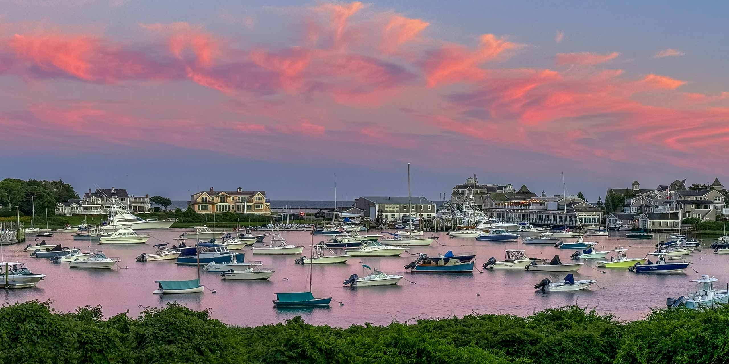 Harbor cruise at Cape Cod with boats at sunset