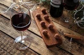 Assorted chocolate truffles on slate at outdoor styled shoot