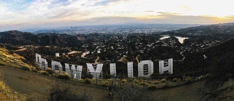Panoramic view of Hollywood sign on hillside at sunset