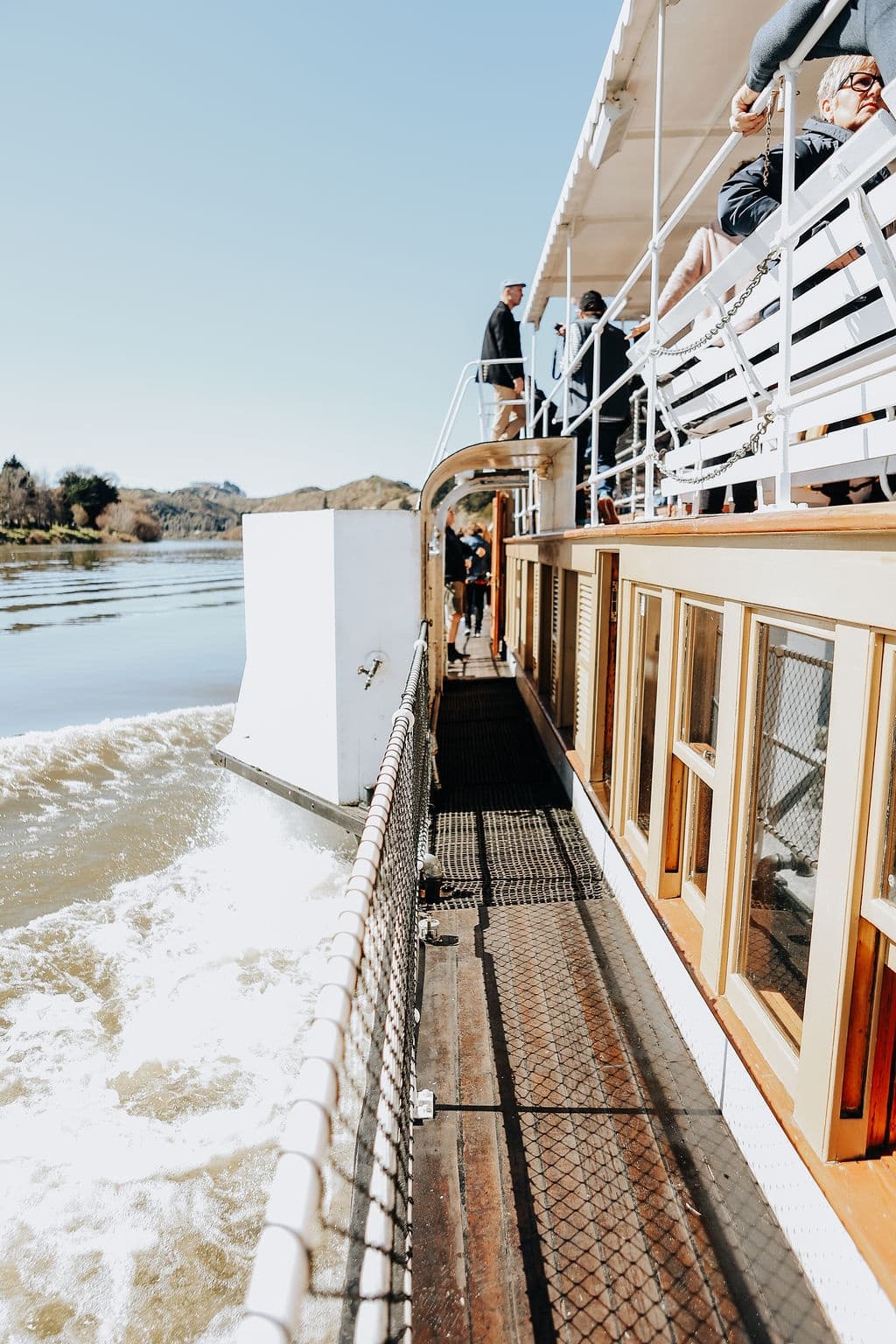 Close-up deck walkway on historic riverboat creating waterside atmosphere