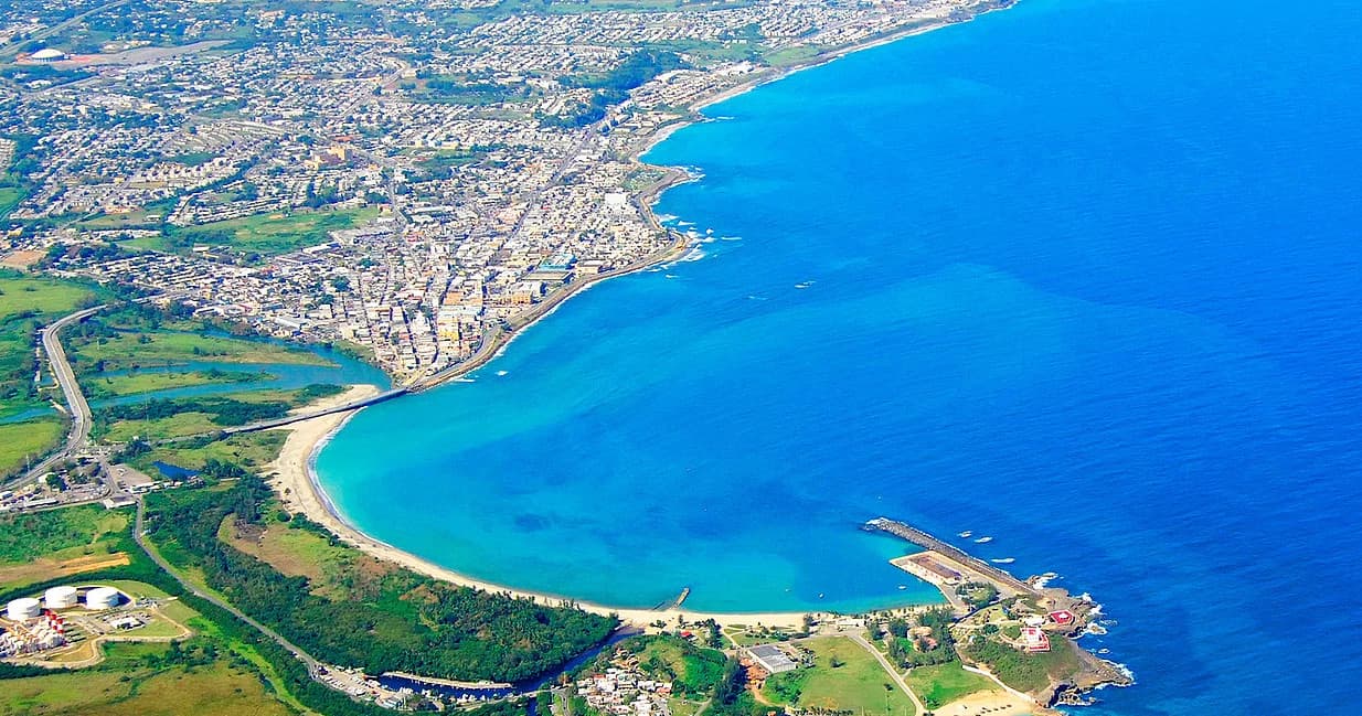 Aerial scenic coastal bay view showcasing turquoise beach for beach tourism