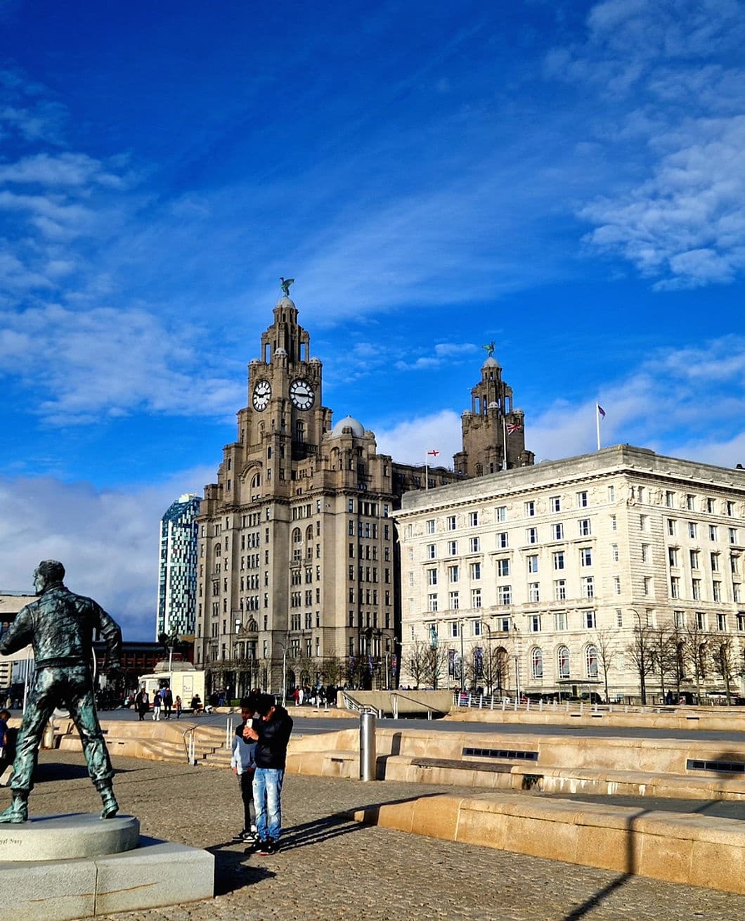 Waterfront cityscape at Liverpool's Pier Head with visitors