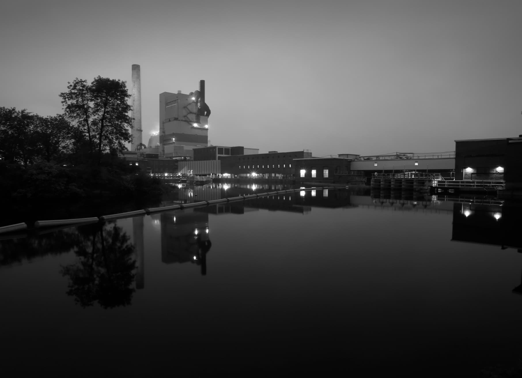 Portland waterfront reflection at dusk, urban river skyline