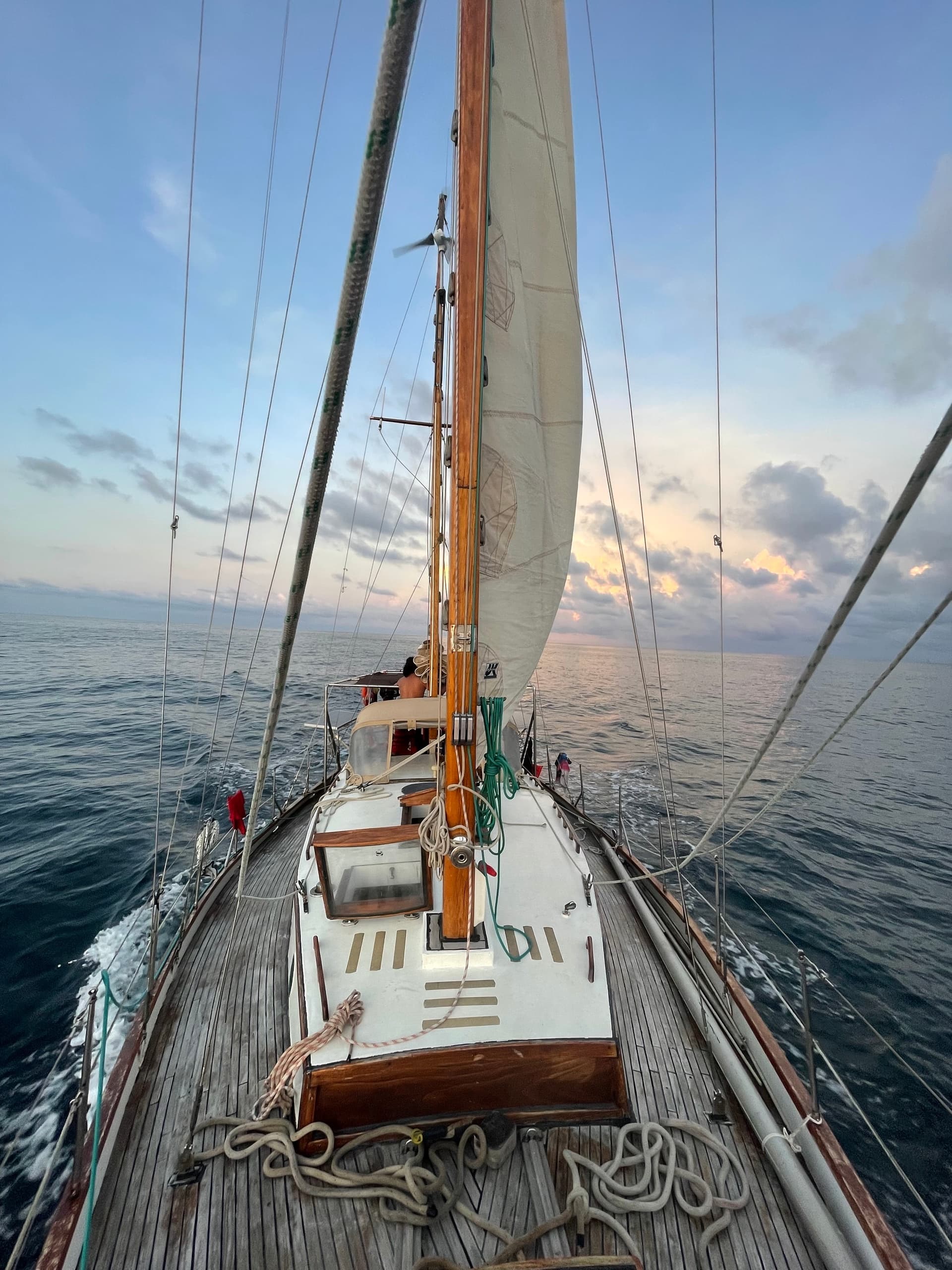 Sailing yacht deck view underway on open sea at dawn