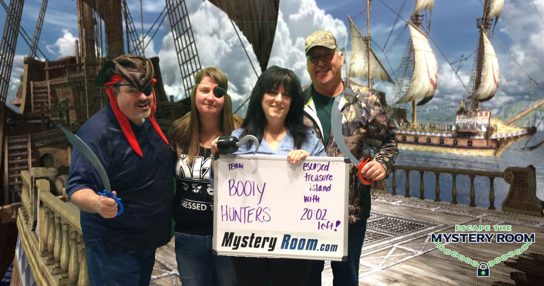 Group posing on pirate ship deck with sails backdrop