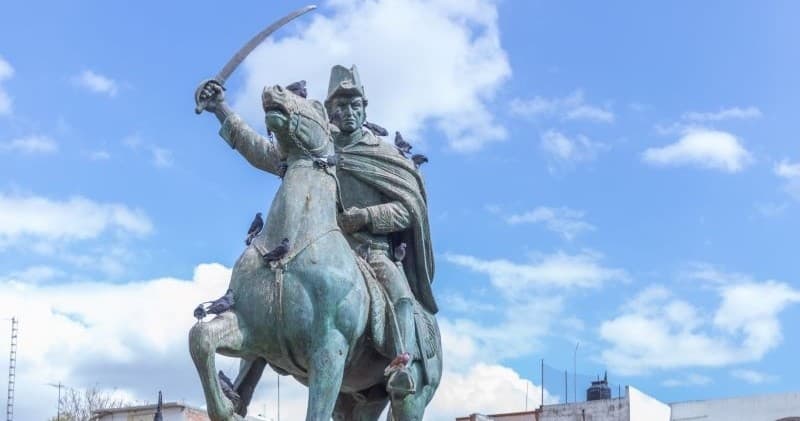 Equestrian statue monument in sunny San Miguel de Allende plaza