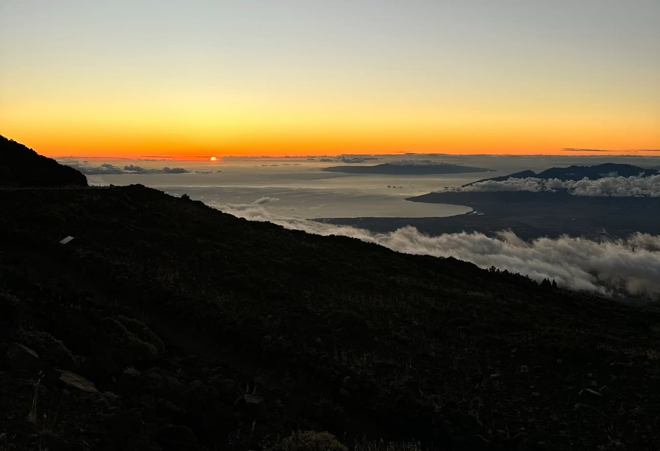 Sunset ridge overlooking cloud inversion, scenic mountain trek