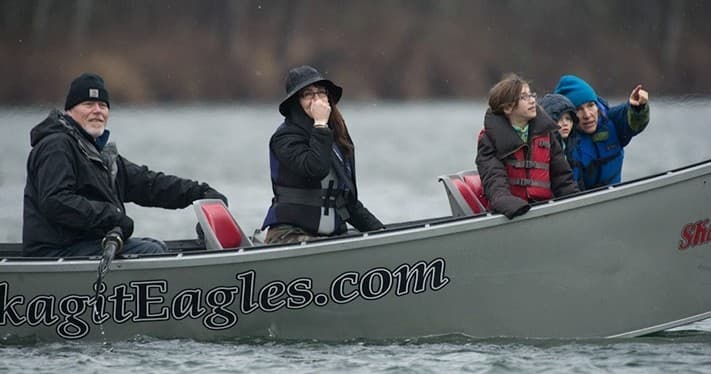 Passengers eagle-watching from boat on Skagit River