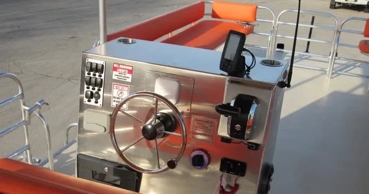 Pontoon boat helm and control console ready for coastal cruise