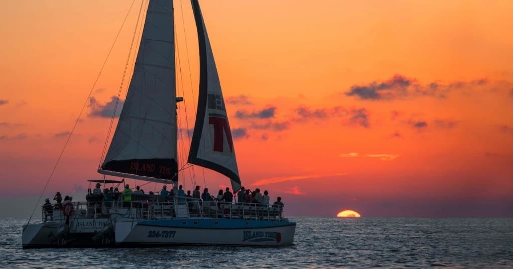 Sunset & Dolphin Watch Sailing Cruise on the Island Time  Catamaran