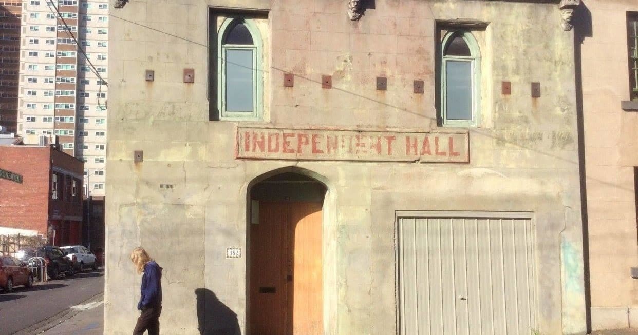 Stone facade of Independent Hall exterior on urban Melbourne street