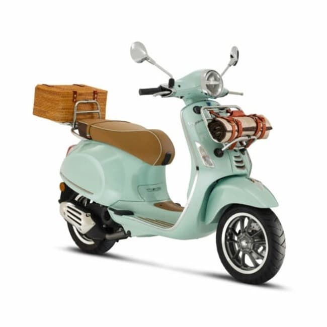 Mint scooter with wicker basket on coastal rental tour