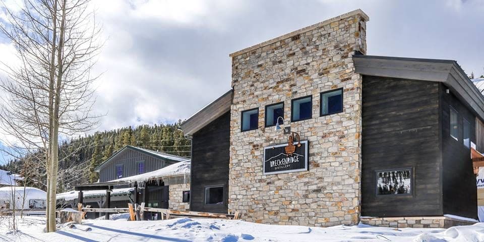 Mountain lodge facade in snowy resort town, alpine setting