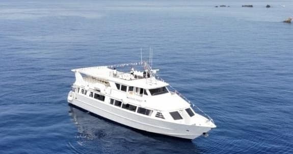 White yacht cruising calm blue Mediterranean waters offshore