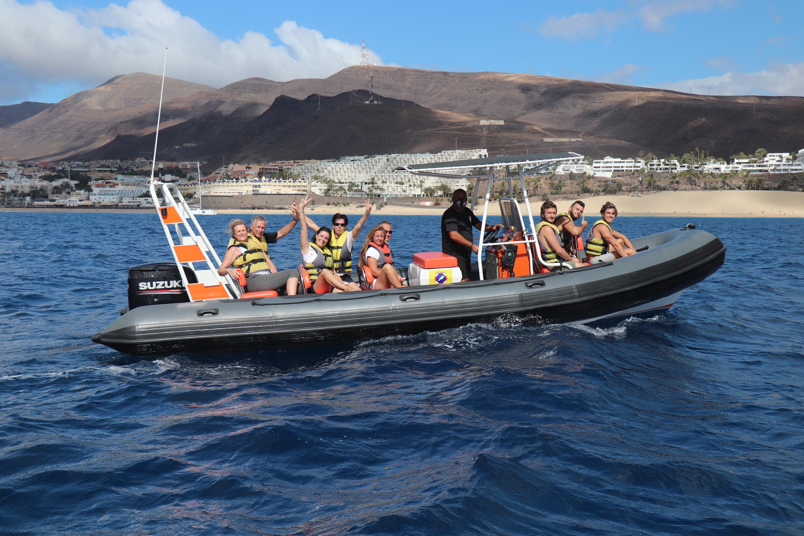 Rigid inflatable boat tour off Fuerteventura coast with passengers