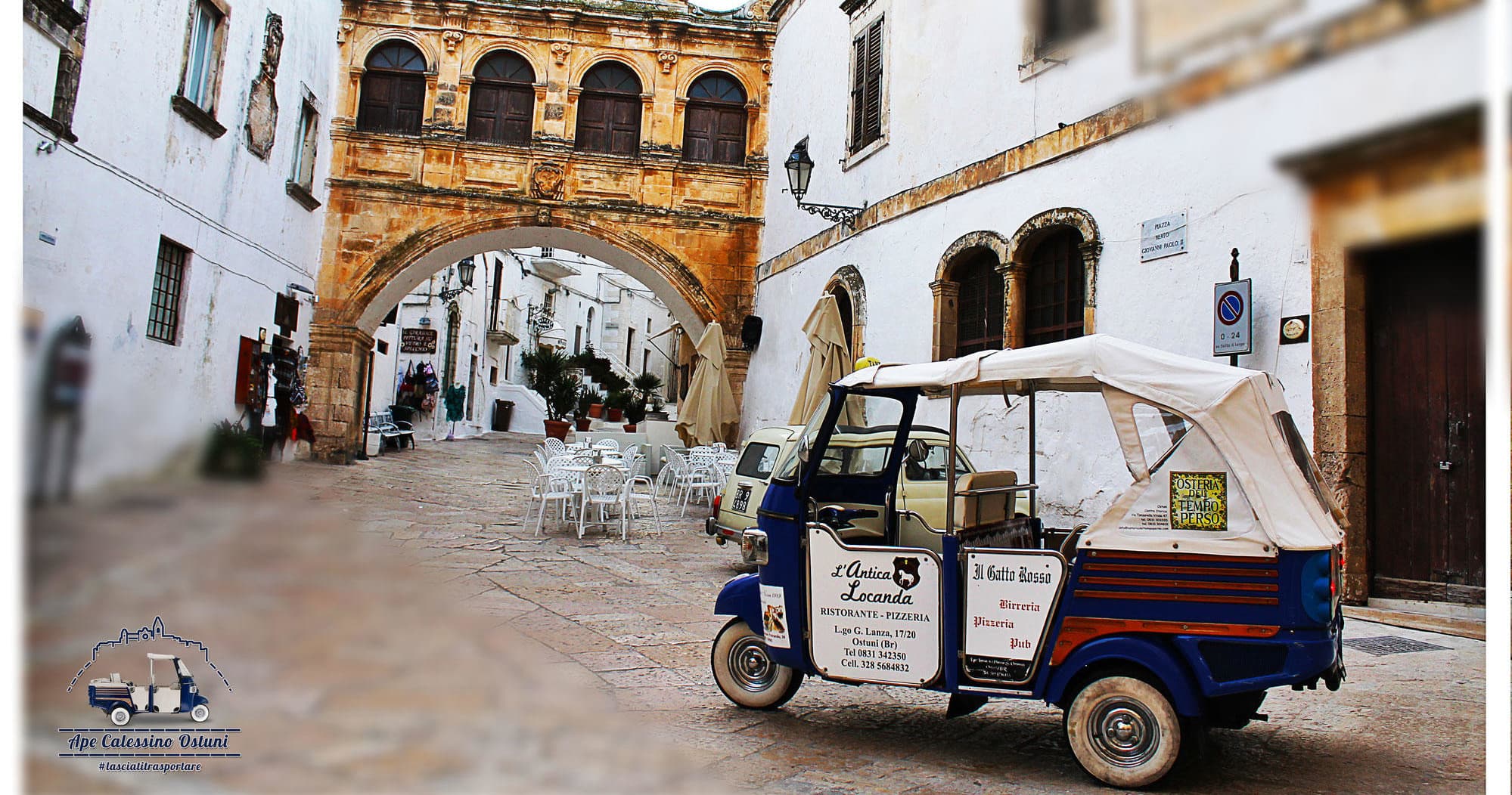Classic Ape tuk-tuk parked under archway in Ostuni old town
