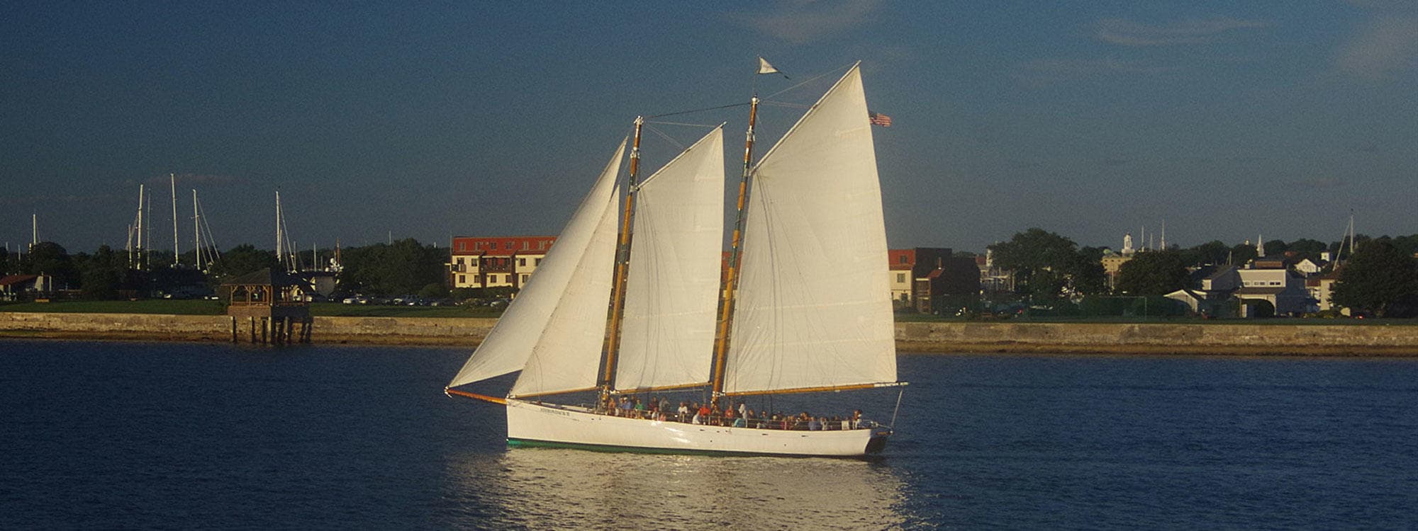 Classic schooner sailing in Newport Harbor coastal tour