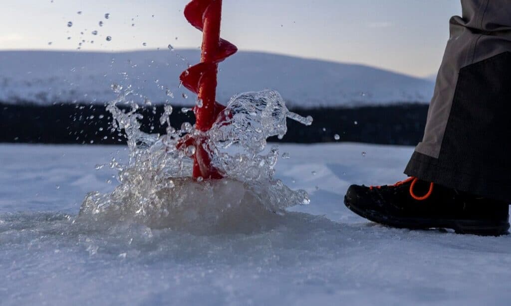 Winter Water Activities at Kelo Resort: Ice Fishing in Lapland