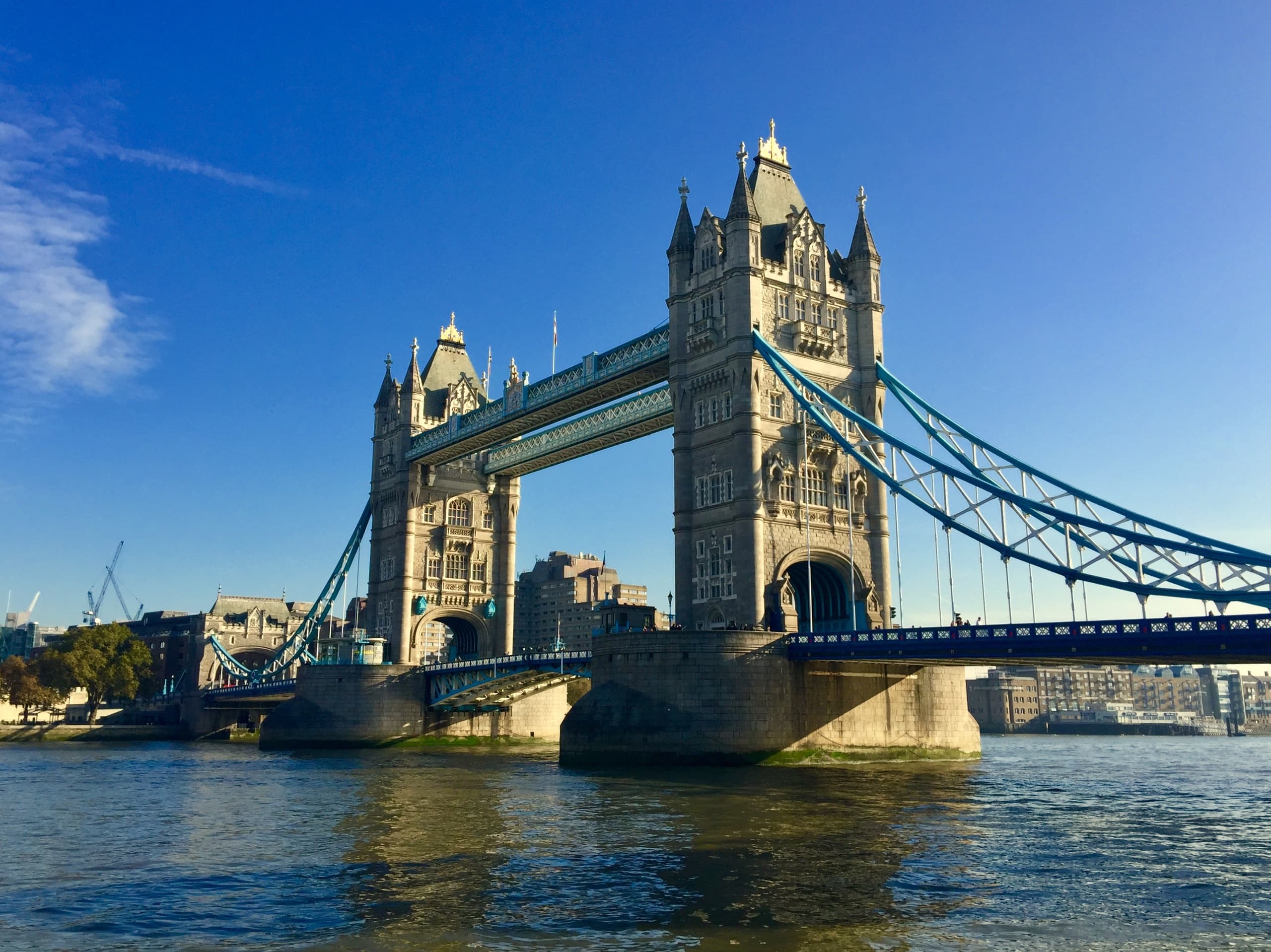 Tower Bridge over Thames River in London, scenic riverside view