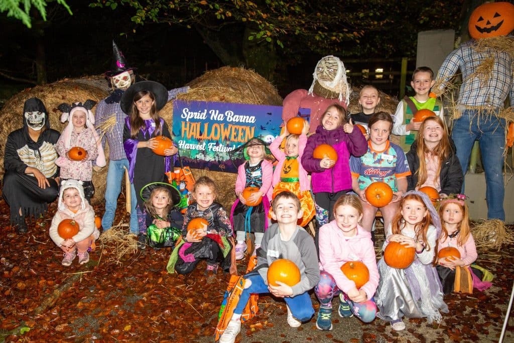 Group of kids trick-or-treating at community Halloween event