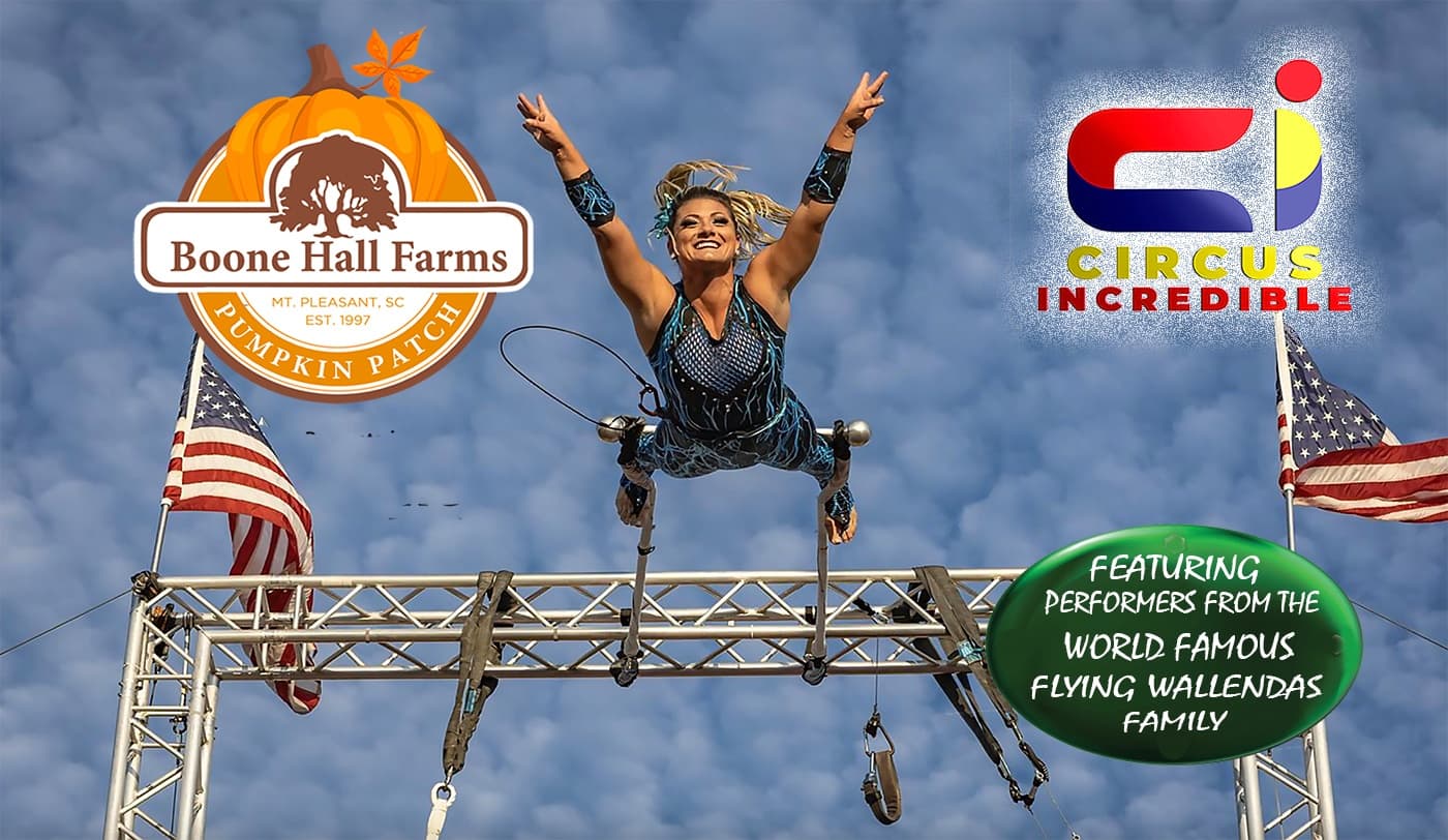 Aerial acrobat flipping above metal rig at Boone Hall Farms outdoors