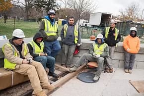 Construction crew on break at outdoor urban construction site