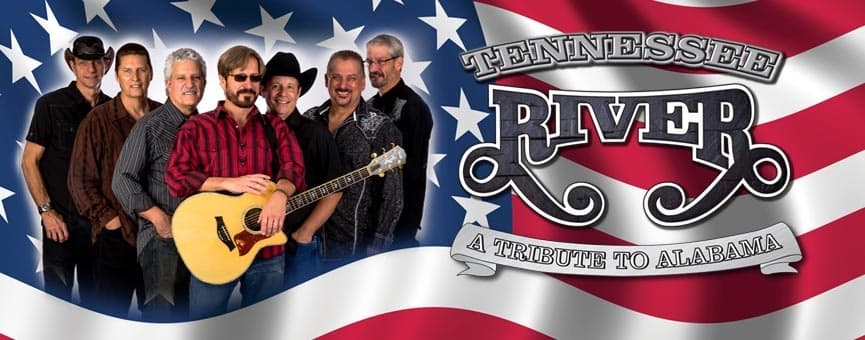 Country band performing with American flag backdrop on stage