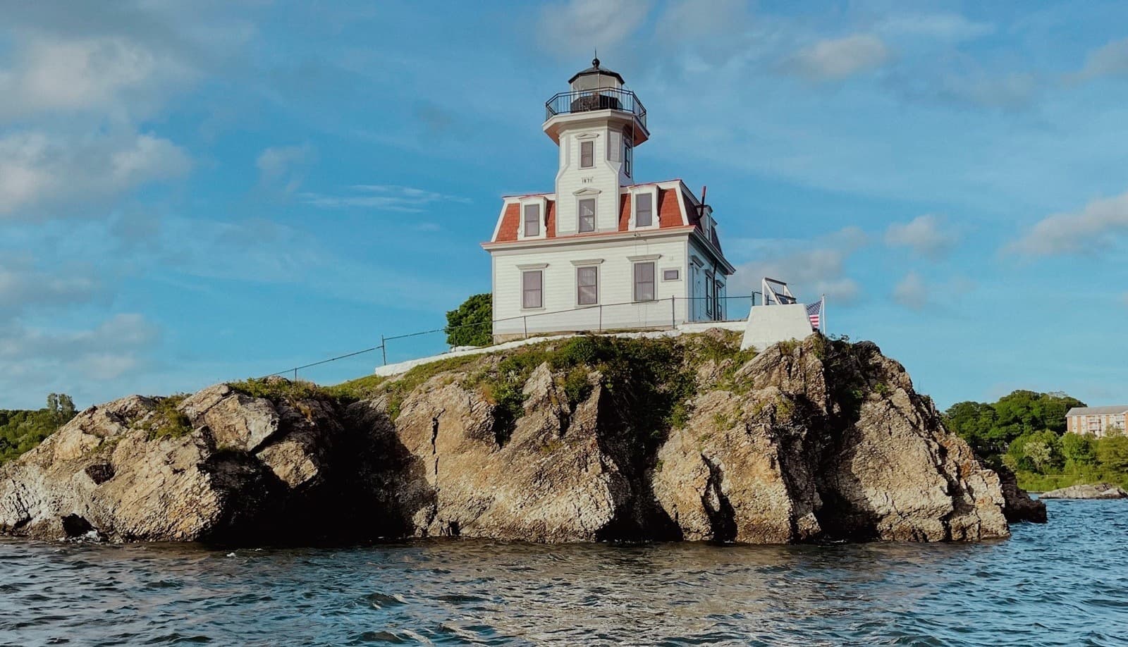 Historic Pomham Rocks Lighthouse atop granite ledge for boat tours