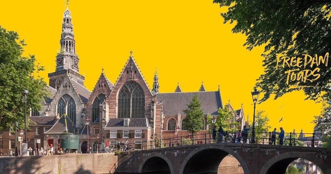 Historic church and canal bridge in Amsterdam guided tour