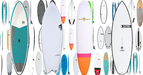 Wide array of surfboards displayed for Kauai surf rentals