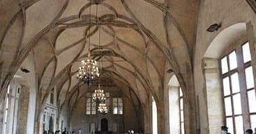 Medieval vaulted hall interior in Prague, historic indoor tour experience