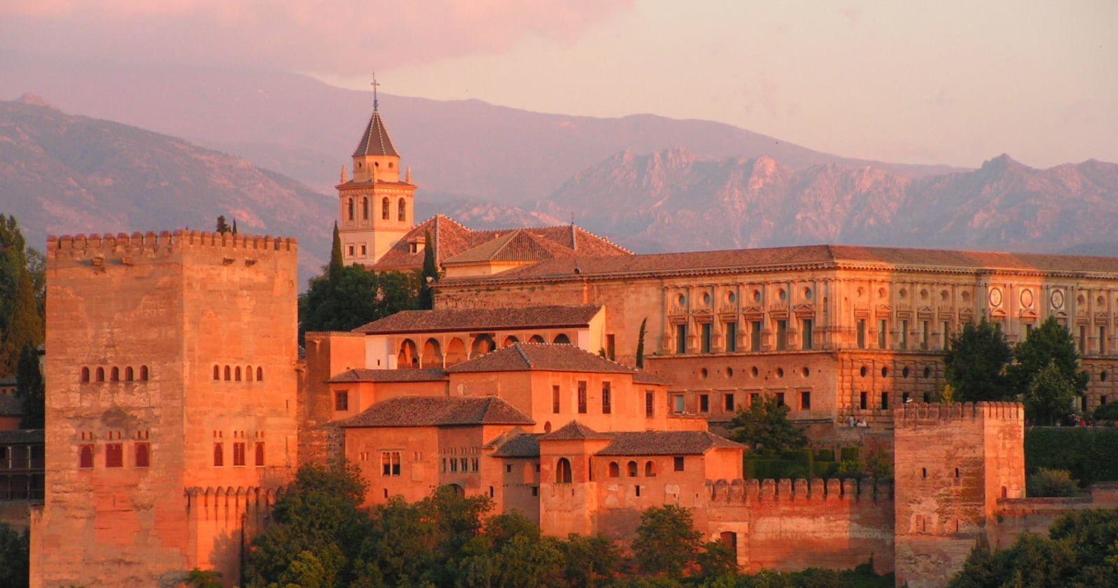 Alhambra palace at sunset overlooking Granada hills, scenic view