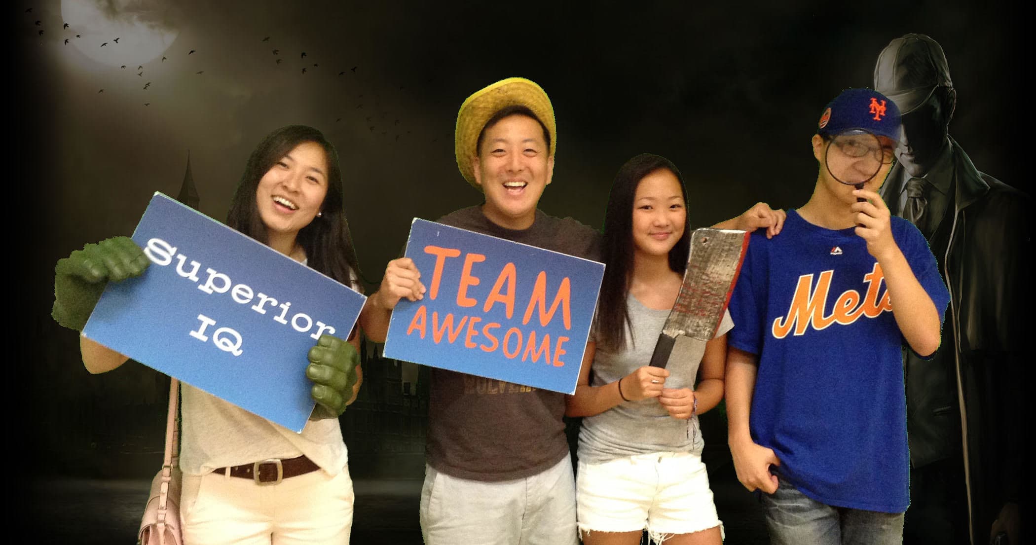 Group holding Team Awesome signs in dark photo studio