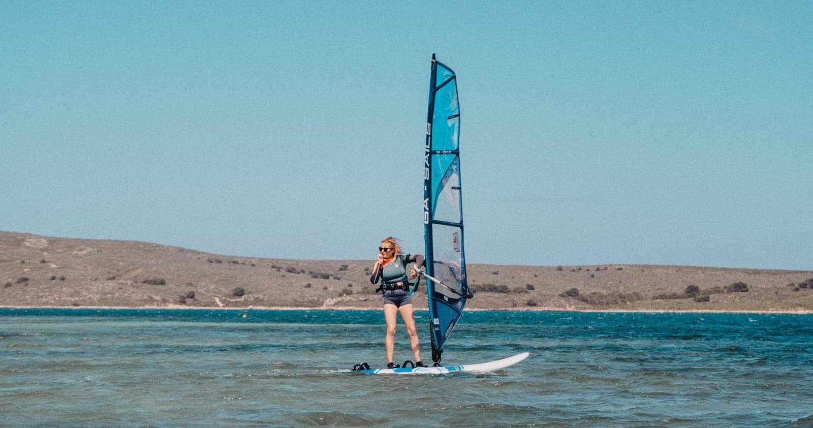 Master Windsurfing Techniques with the Clase de Windsurf Nivel 2 in Fornells, Spain