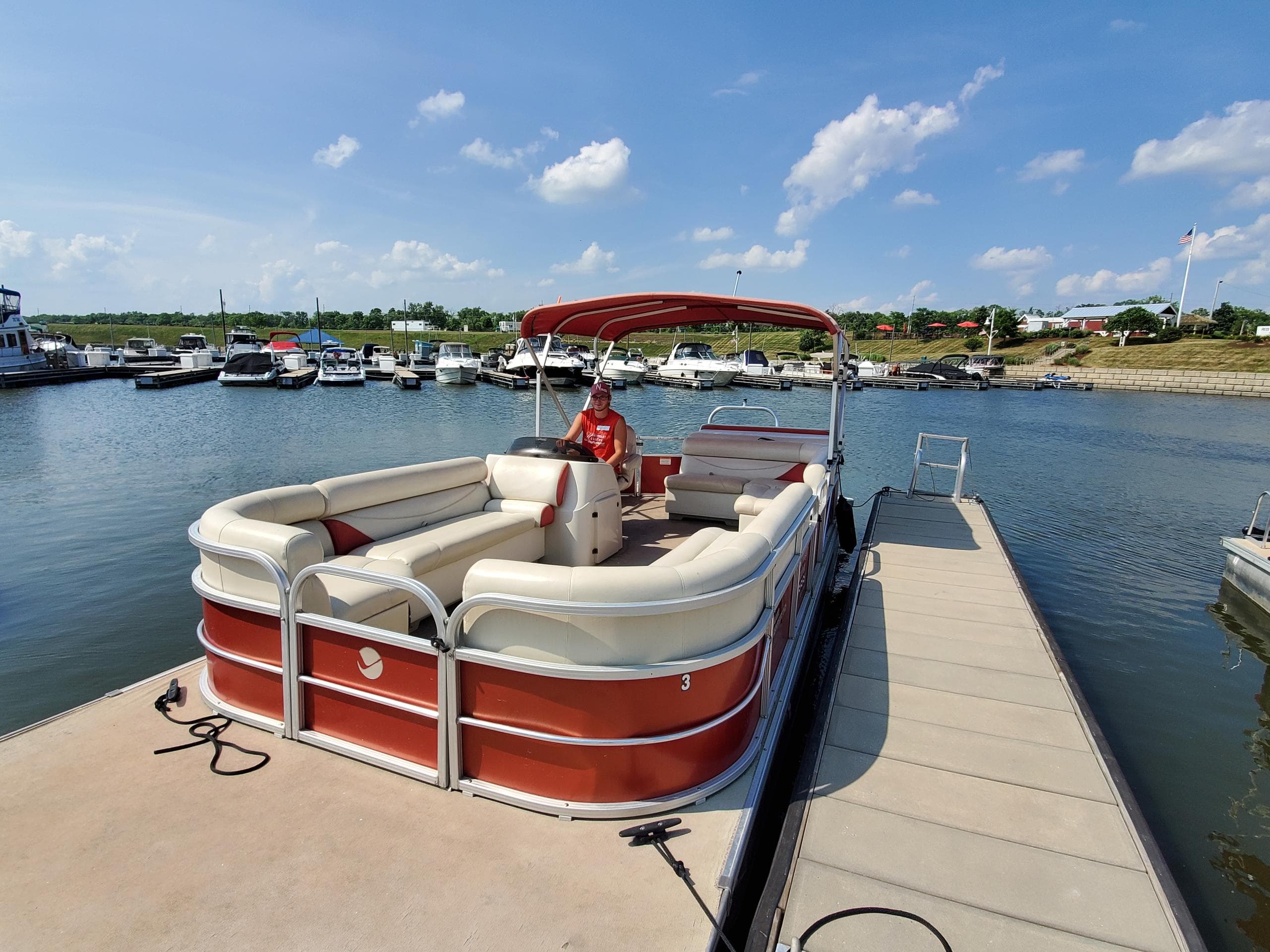 Pontoon boat docked at Heritage Harbor Ottawa, lakeside cruise