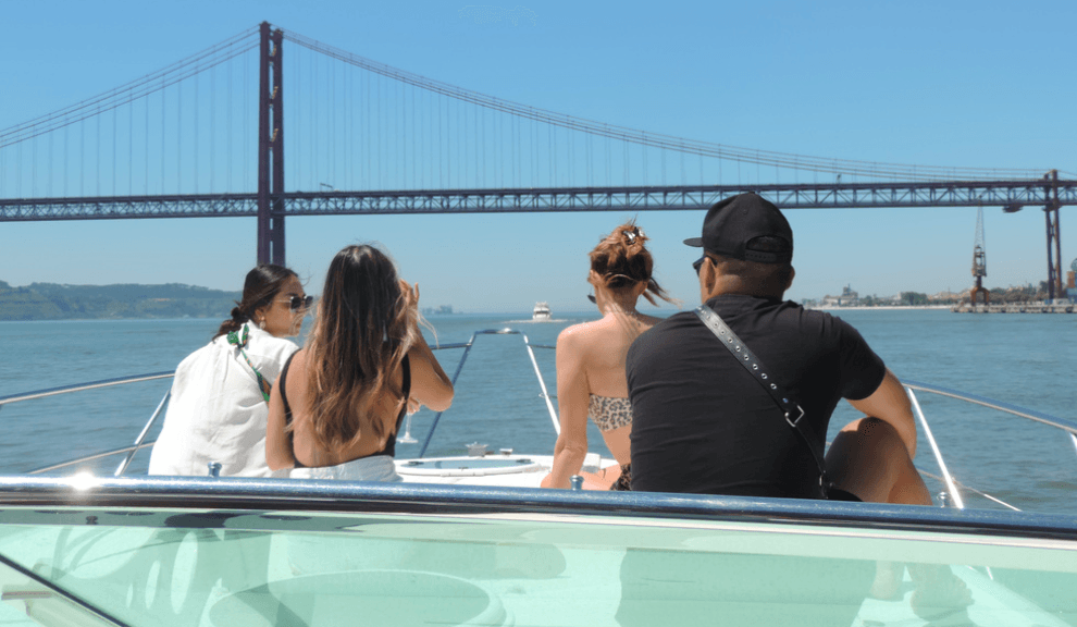 Passengers enjoying boat tour under Golden Gate Bridge, San Francisco