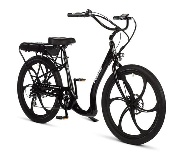 Black electric cruiser bike on white studio backdrop, city rides
