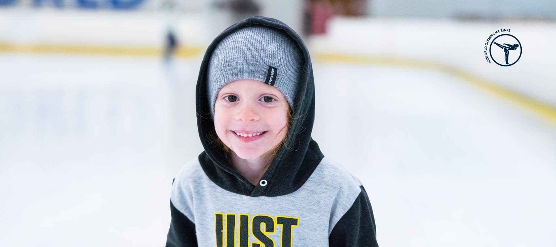 Smiling child ice skating at Iceworld Boondall indoor rink session