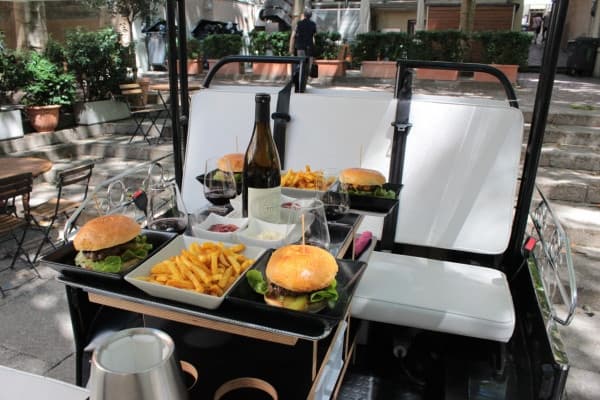 Tuk-tuk street food stop with burgers on outdoor seats