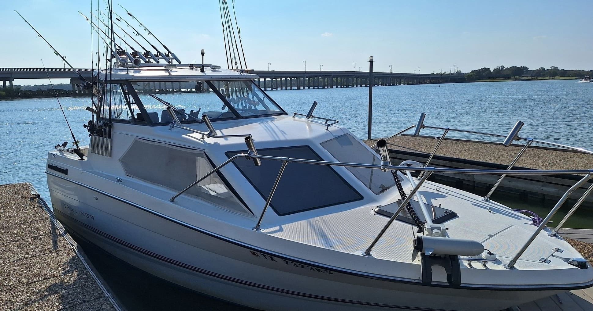 Sportfishing cabin cruiser docked at marina ready for fishing trip