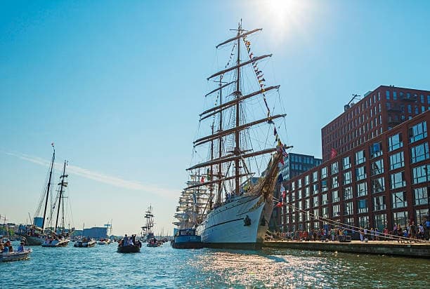 Tall sailing ship in harbor, scenic maritime view of Amsterdam port