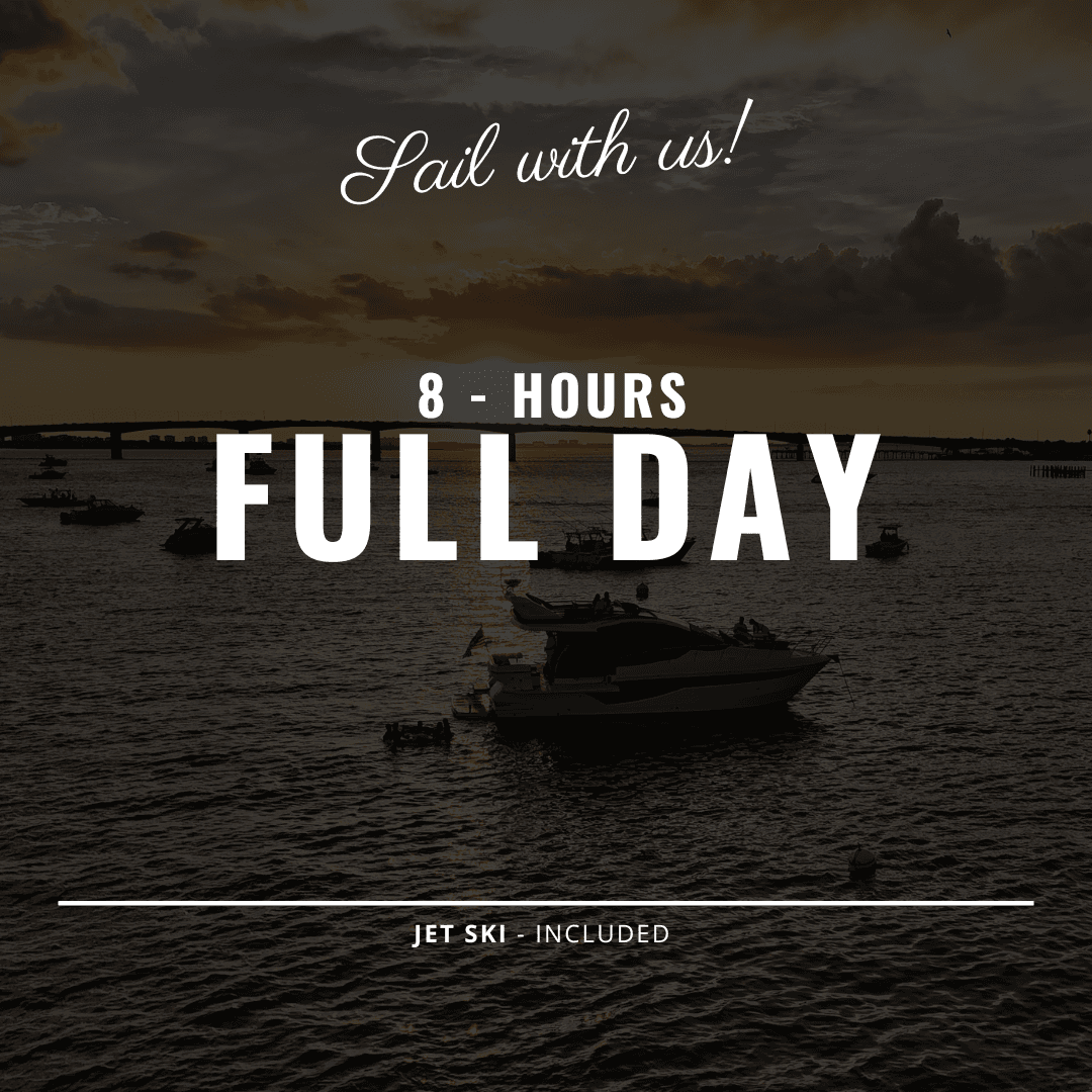 Sunset yacht cruise on coastal harbor with anchored boats