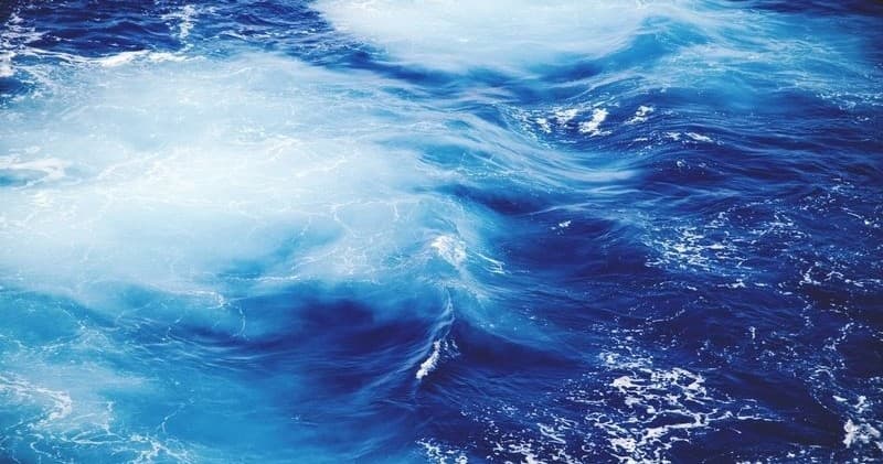 Open ocean waves and deep blue sea for coastal boat adventures