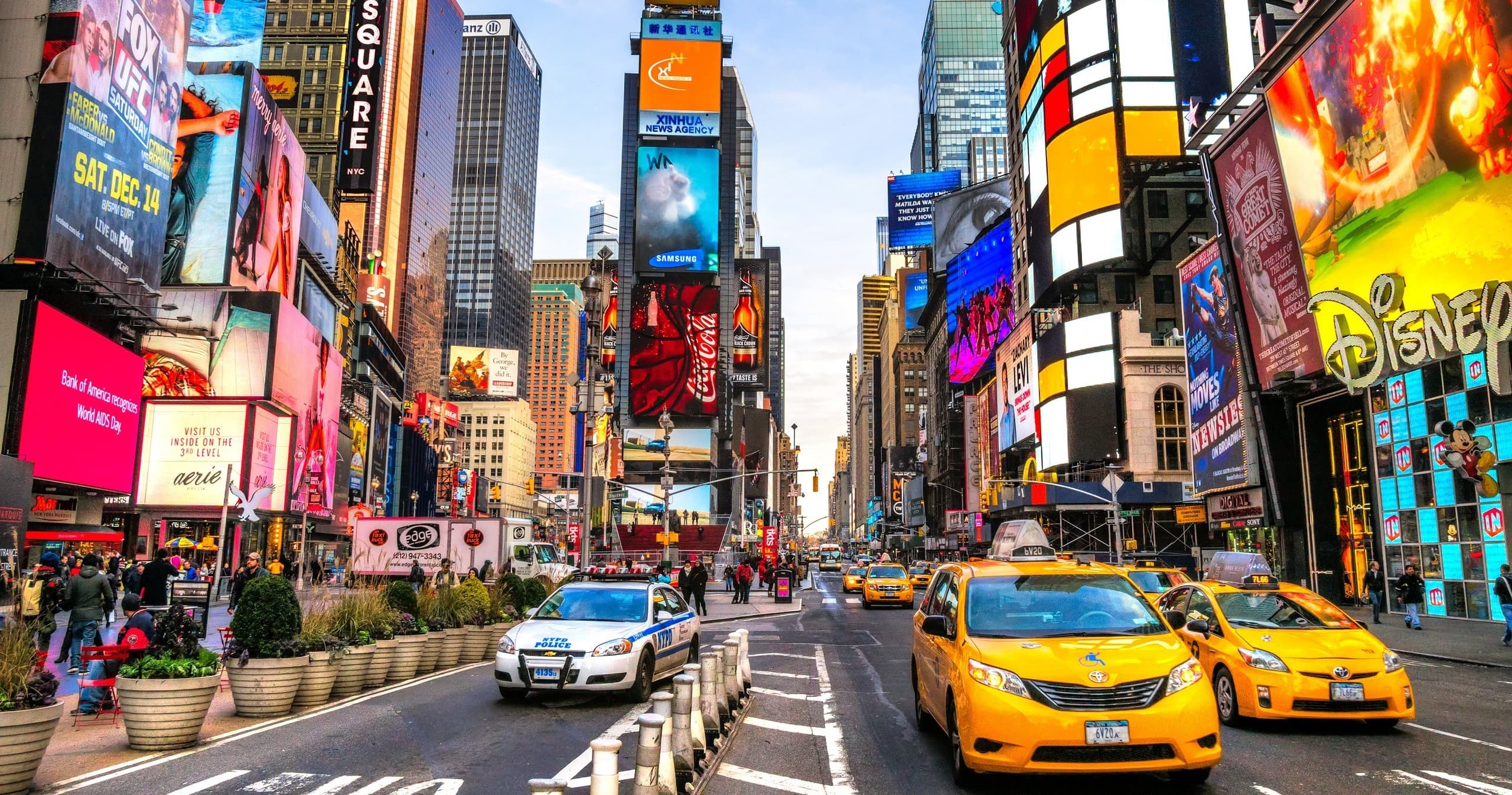 Times Square street scene with yellow taxis and billboards