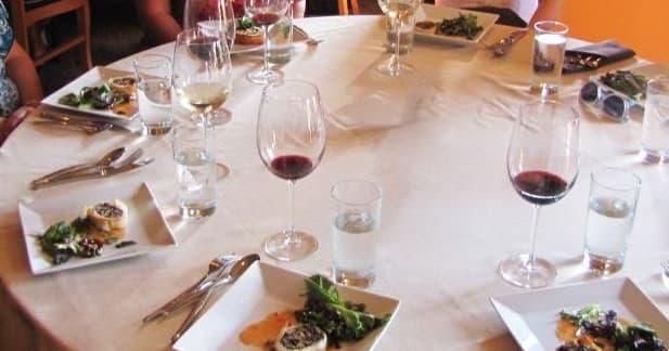 Wine glasses and plated tasting at indoor Cleveland food tour