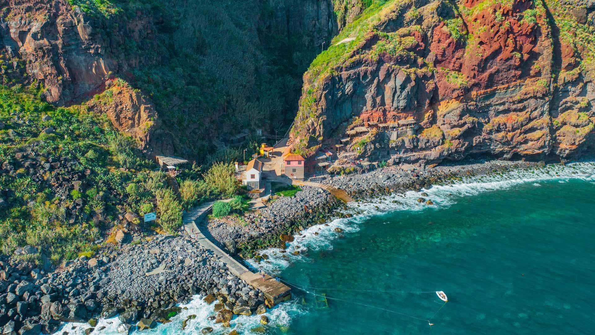 Aerial coastline view of Madeira cliffs and turquoise bay