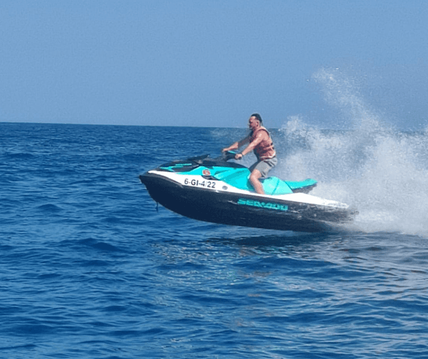 Personal watercraft jumping over waves off Fuengirola coast