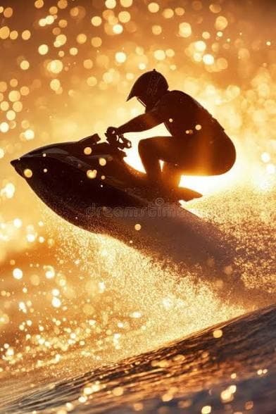 Silhouette rider jumping a jetski over glowing sunset spray on ocean