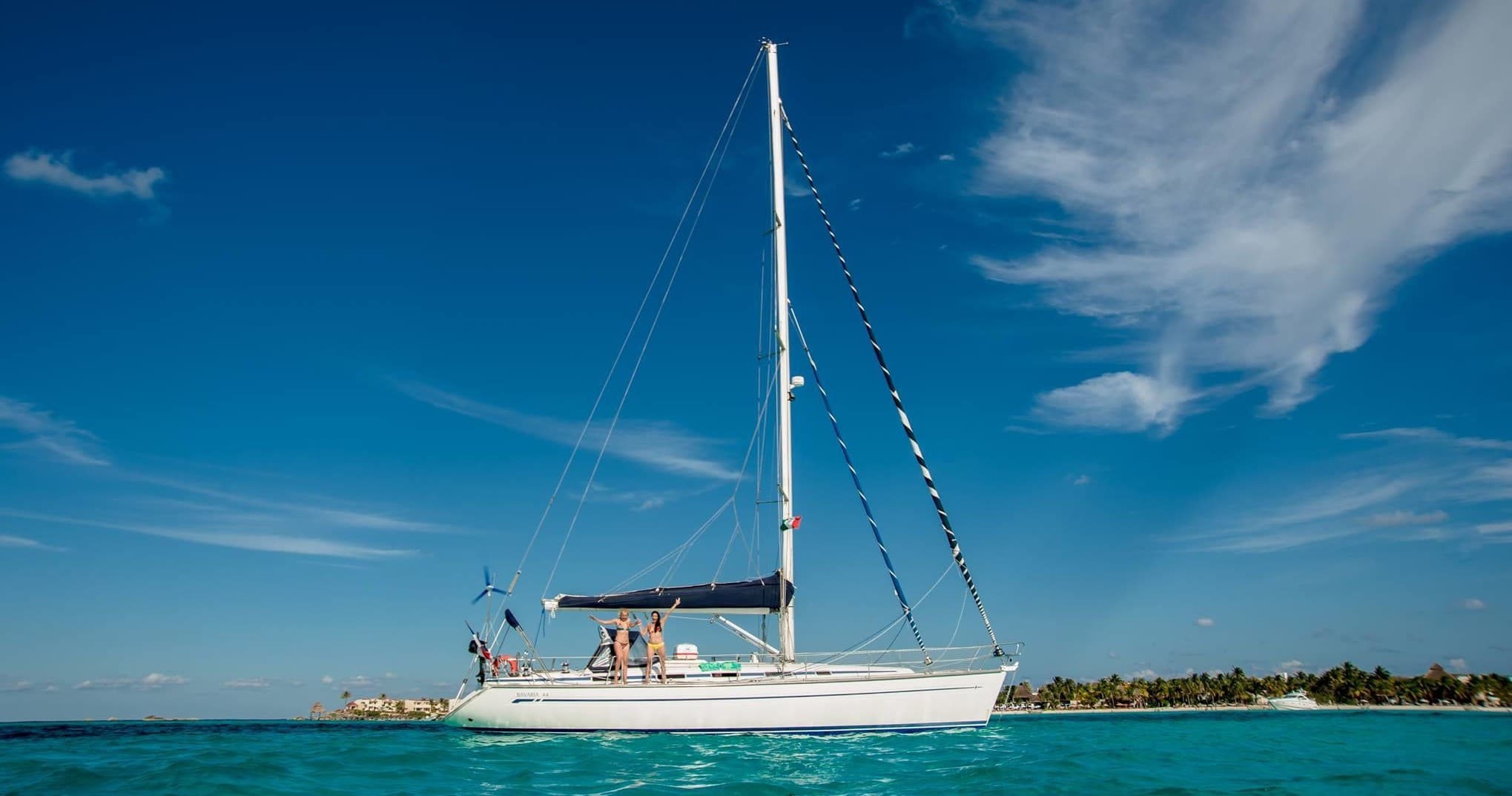 Sailing catamaran cruising turquoise waters off Cancun beach